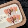 Elegant Peach and Burgundy Bow Pearl Handmade Press - On Nails